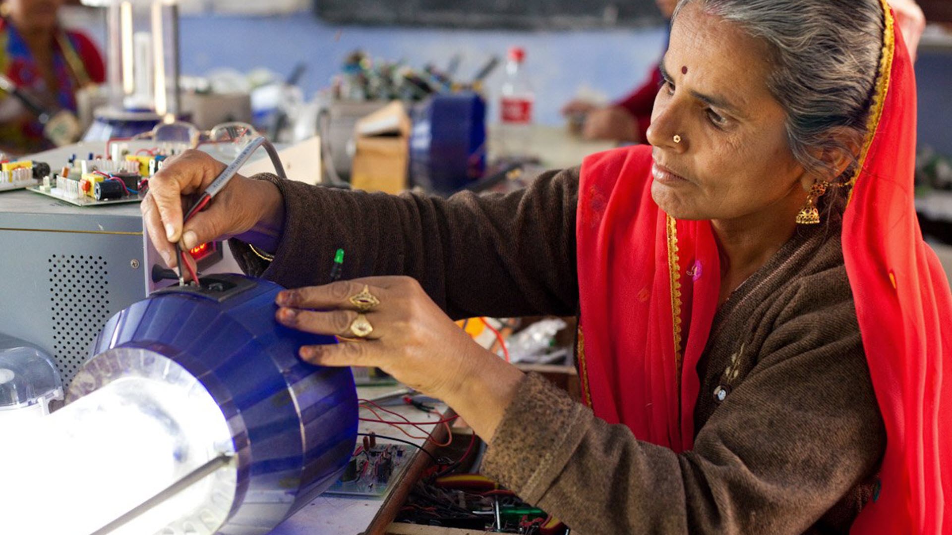 UN woman at work with semi-manufactured goods